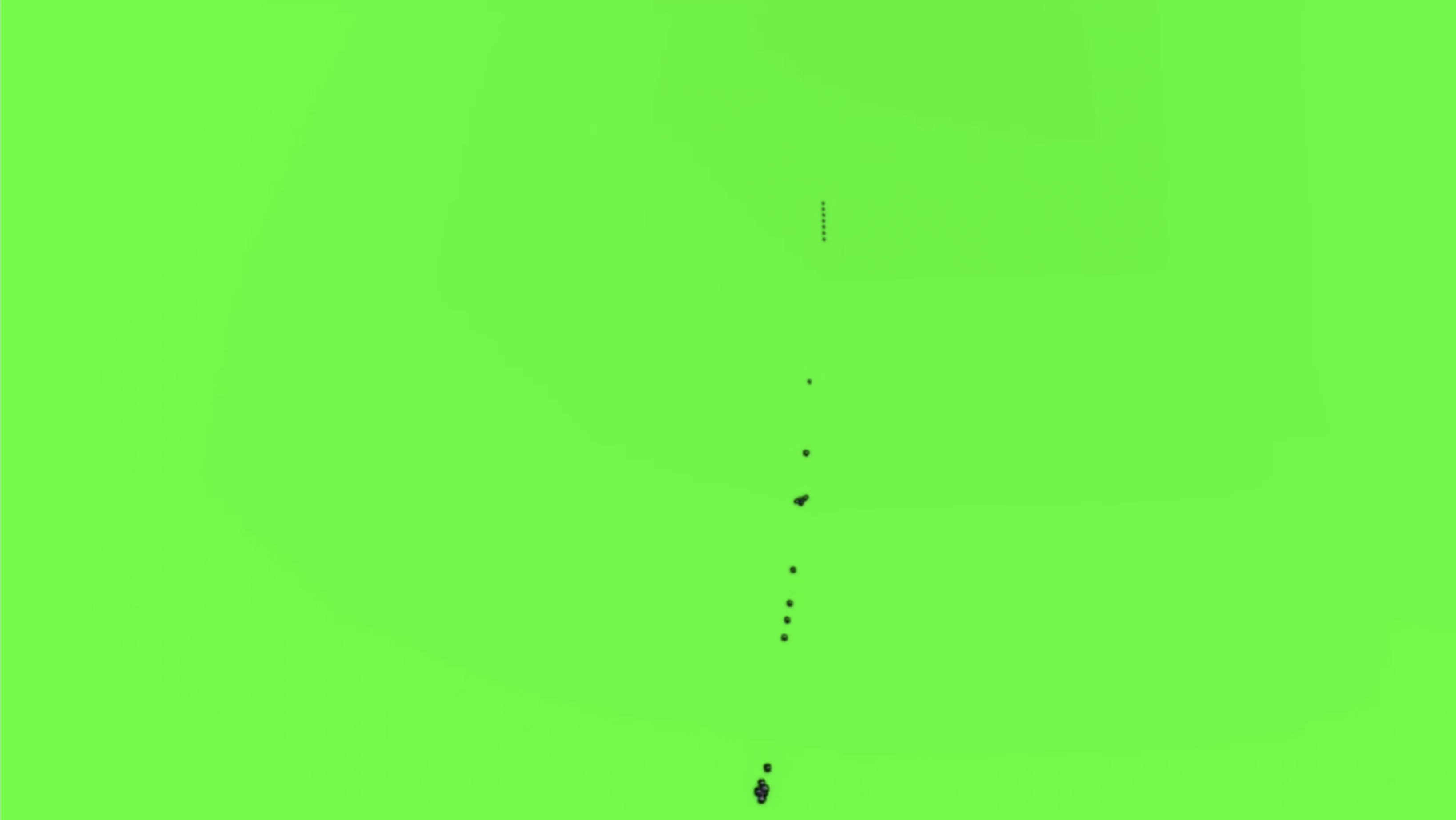 A rectangular video still from the film “Try to Forget” by artist Caroline Coolidge which is entirely a bright, artificial green with about twenty small black masses in the center of the frame in a line from top to bottom.